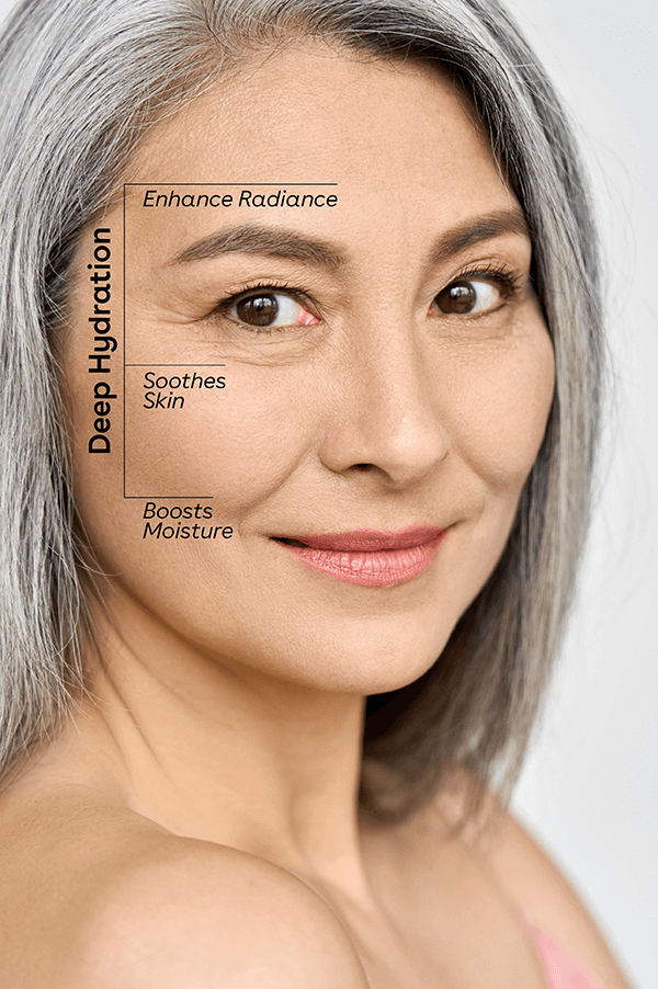 Closeup of mature Asian woman using oil cleanser